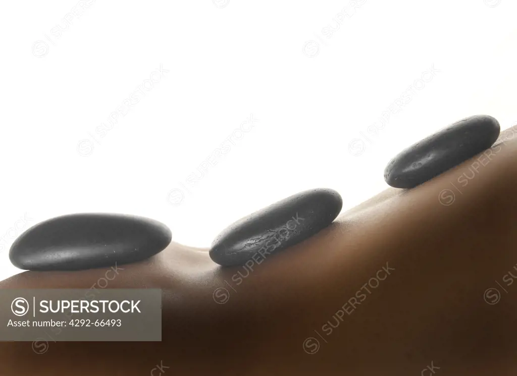 Hot stone therapy, woman's back