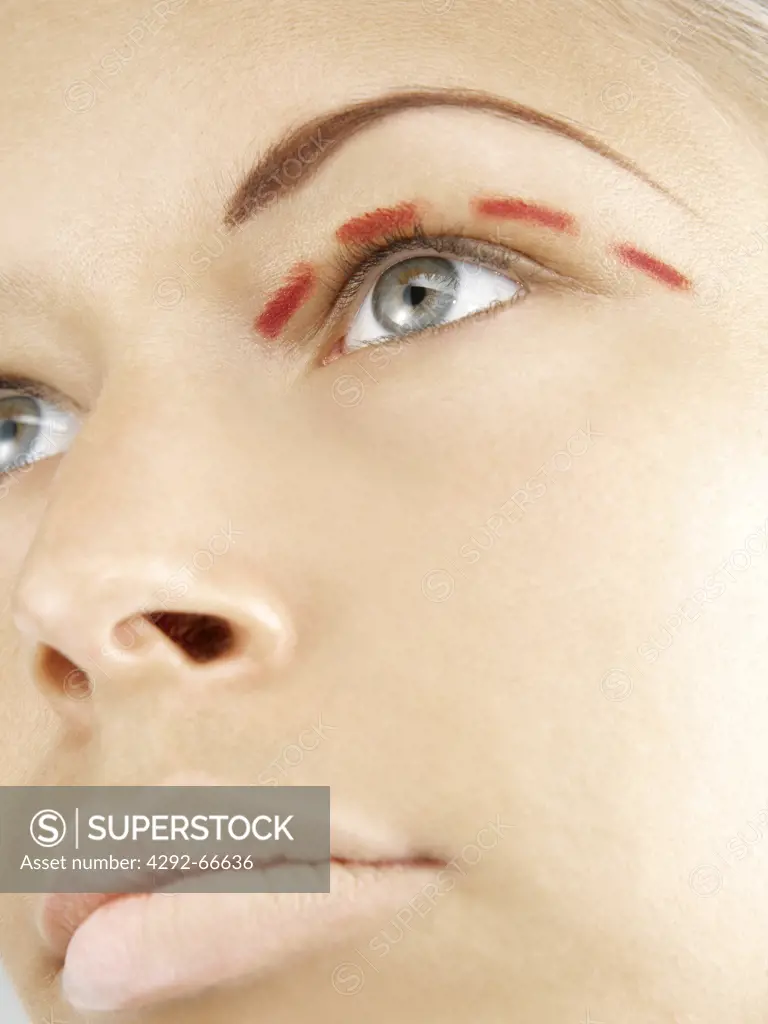 Woman with markings around eye
