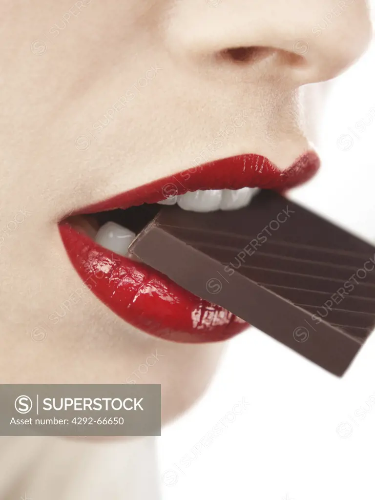 Woman biting chocolate