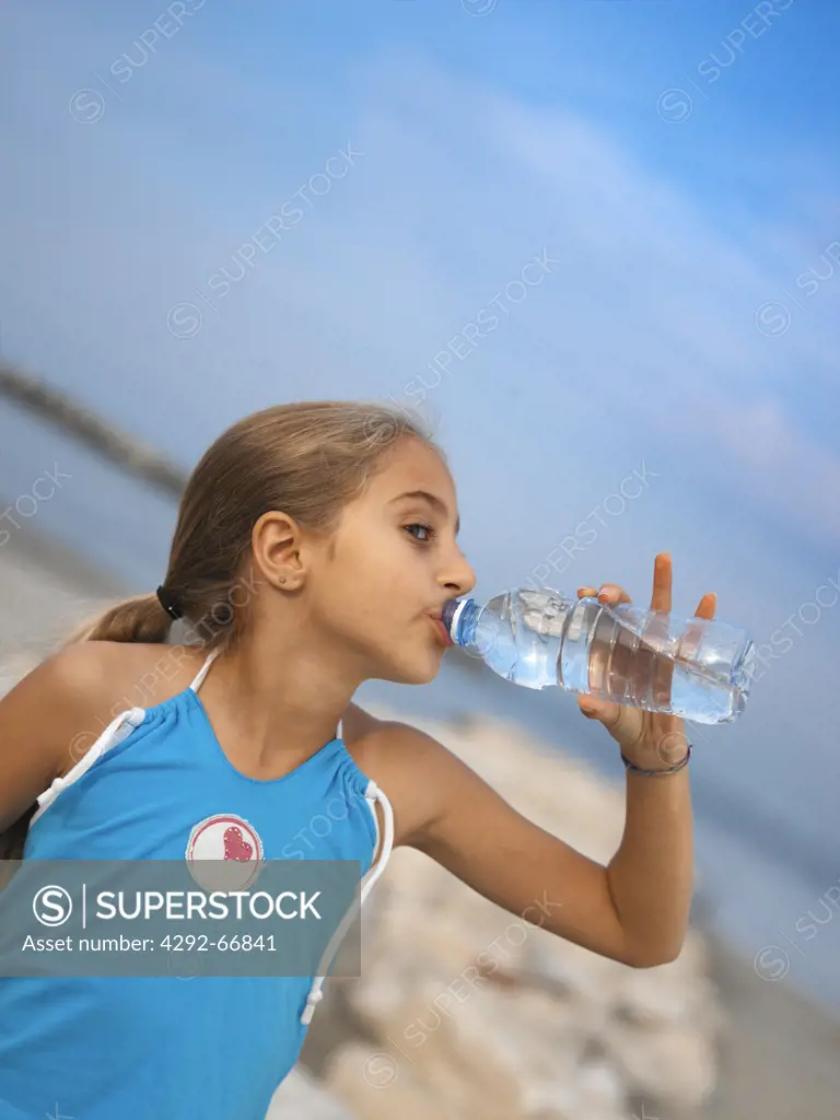 Girl drinking water from a bottle