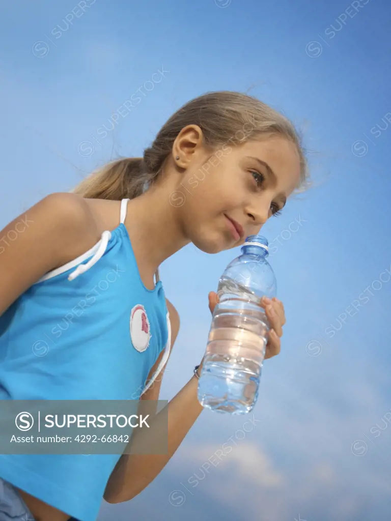 Girl with a botle of mineral water