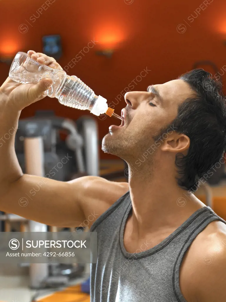 Man drinking water after working out