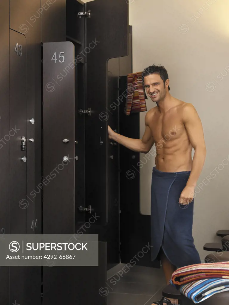 Portrait of a man standing in a changing room