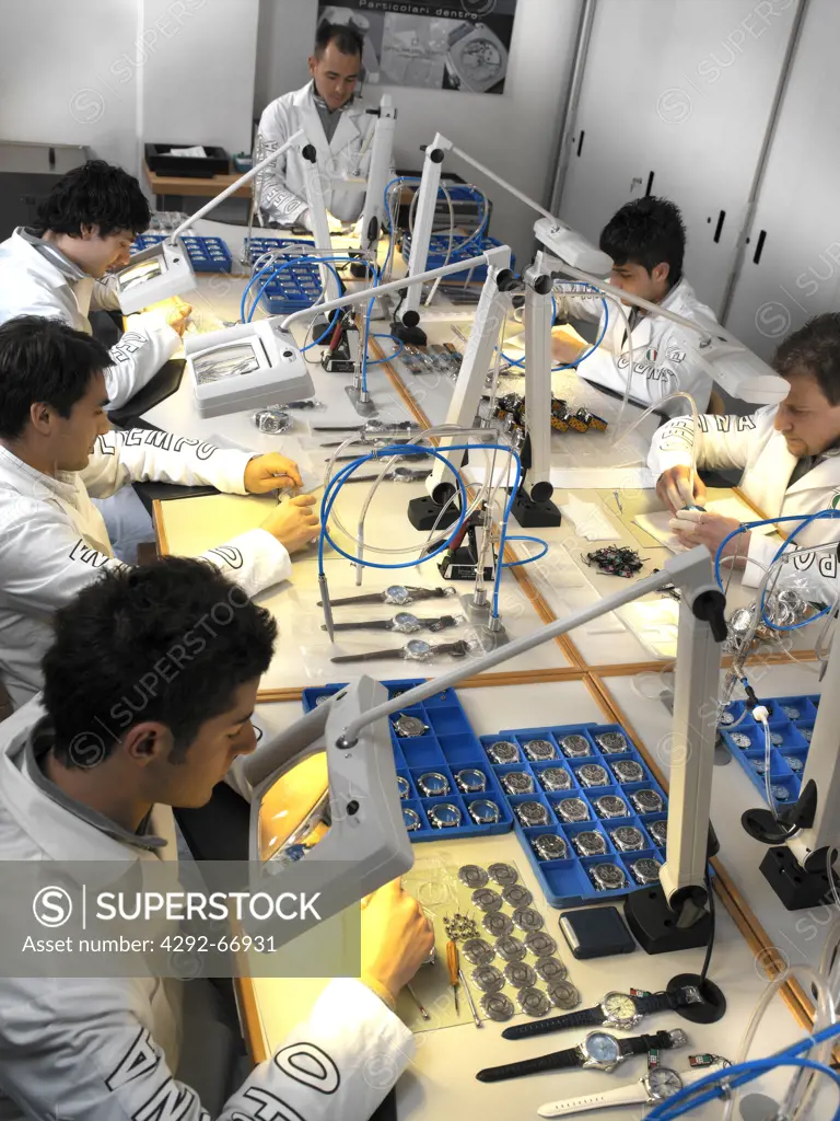 Technicians in wristwatch factory