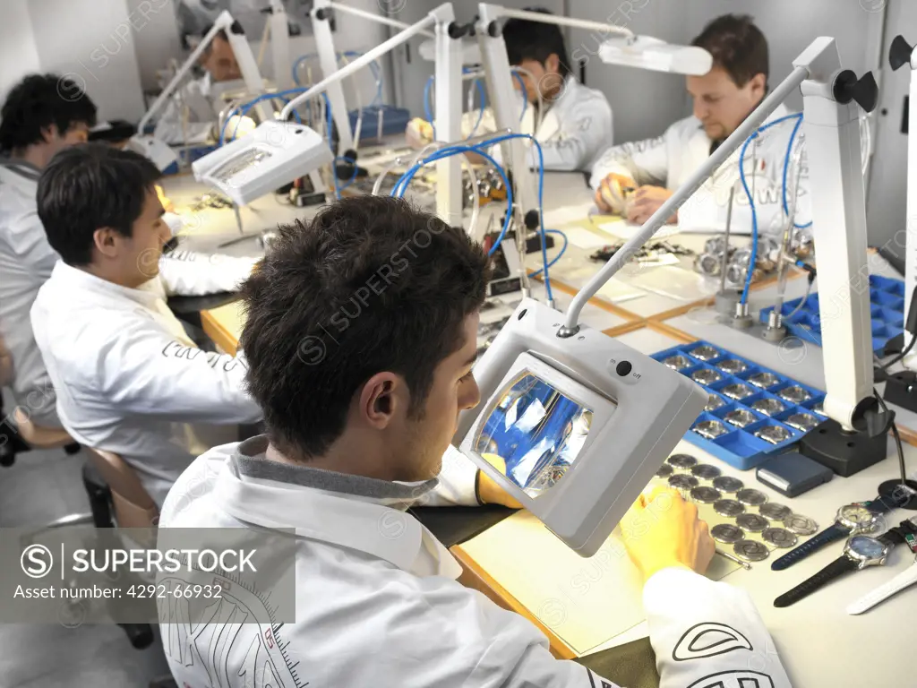 Technicians in wristwatch factory