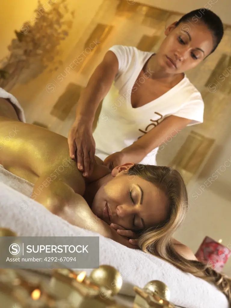 Woman in spa receiving massage