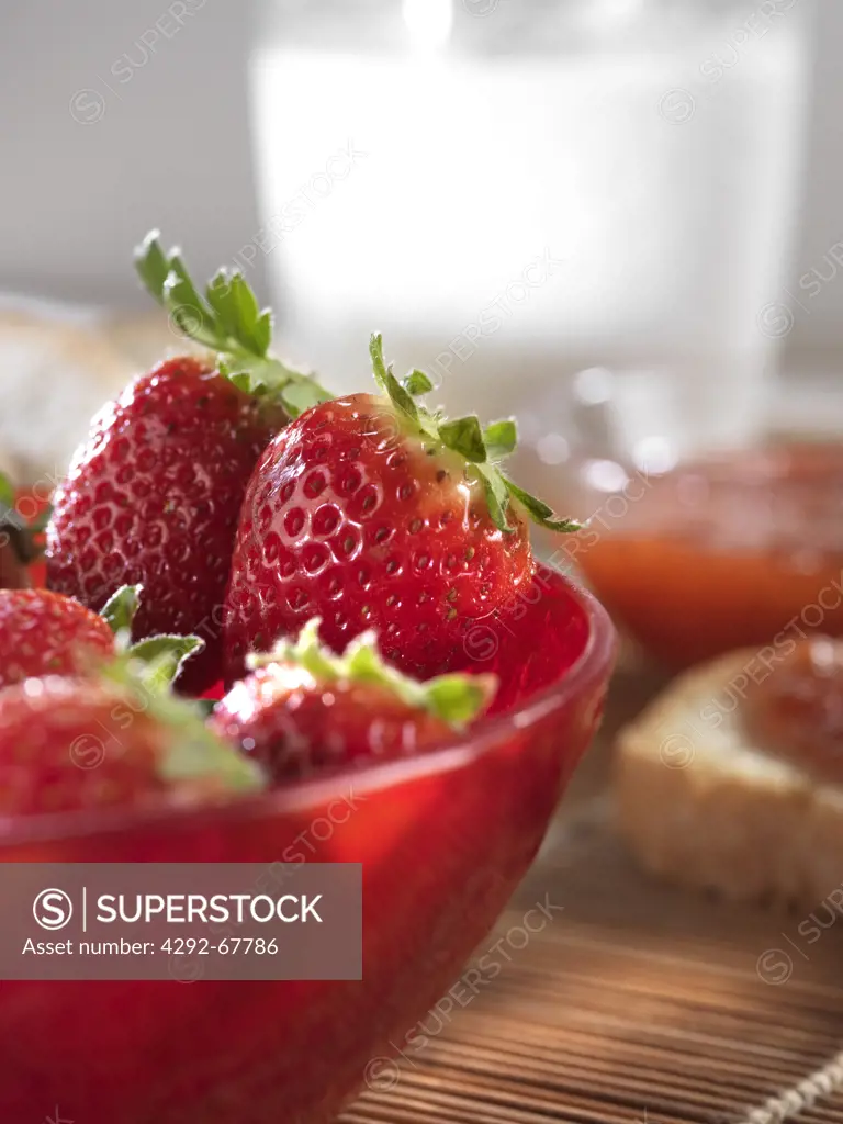 Strawberries and bread with jam