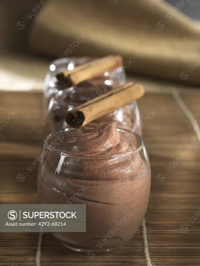 Glasses of chocolate mousse with cinnamon