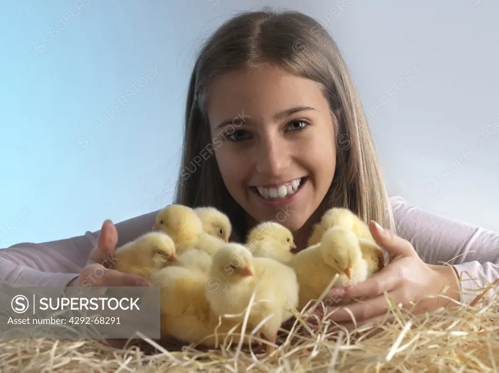 Portrait of teenage girl with chicks