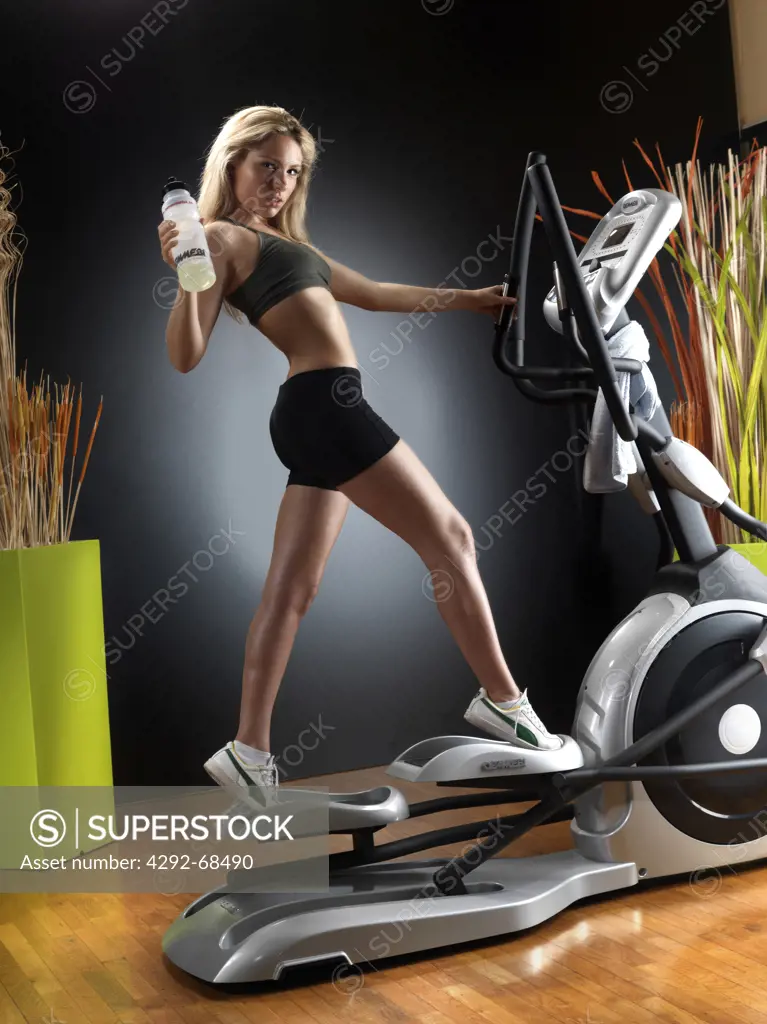 Woman at gym on exercise machine
