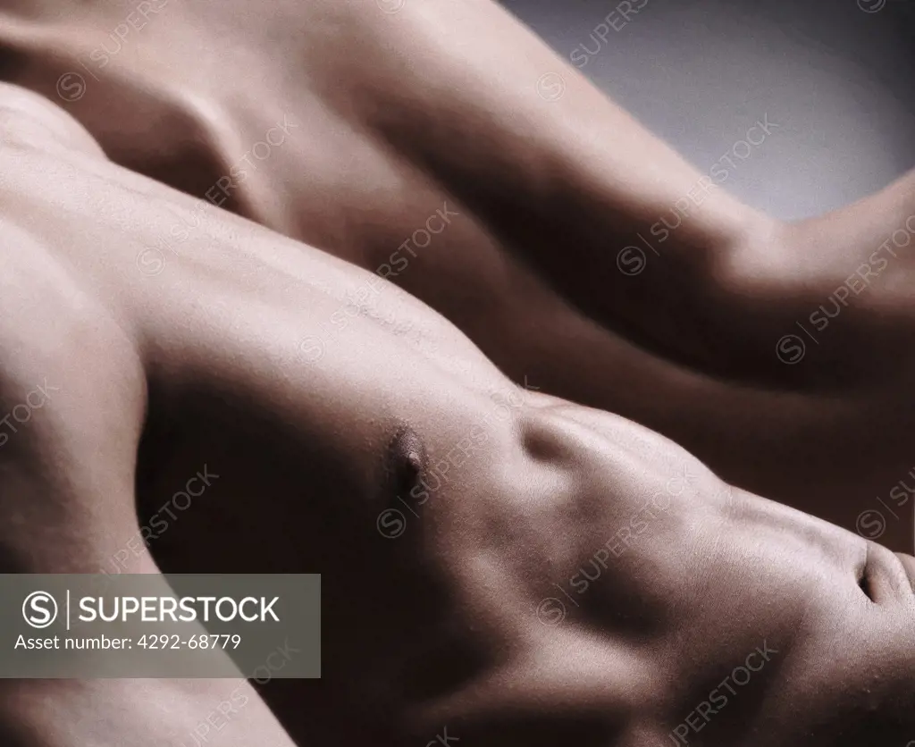 Studio shot of a naked man chest and woman back
