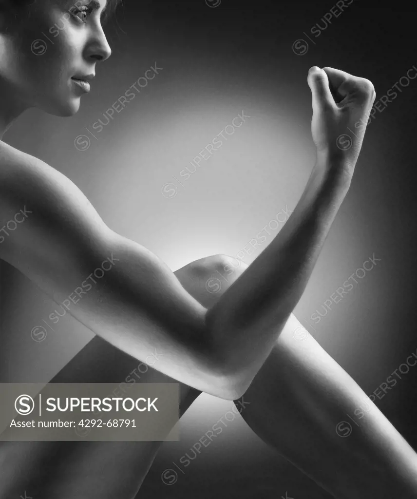Woman flexing arm muscles