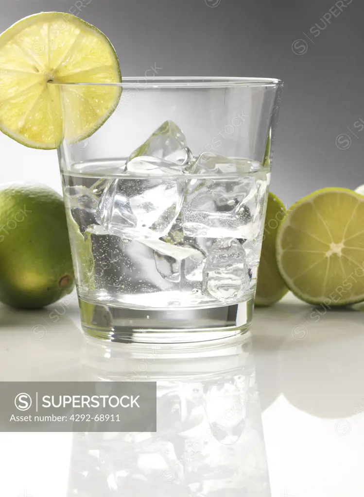 Glass of water with ice and lime