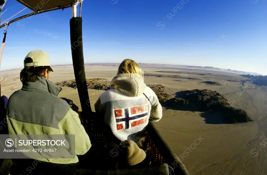 Africa, Namibia, hot air balloon flying over desert