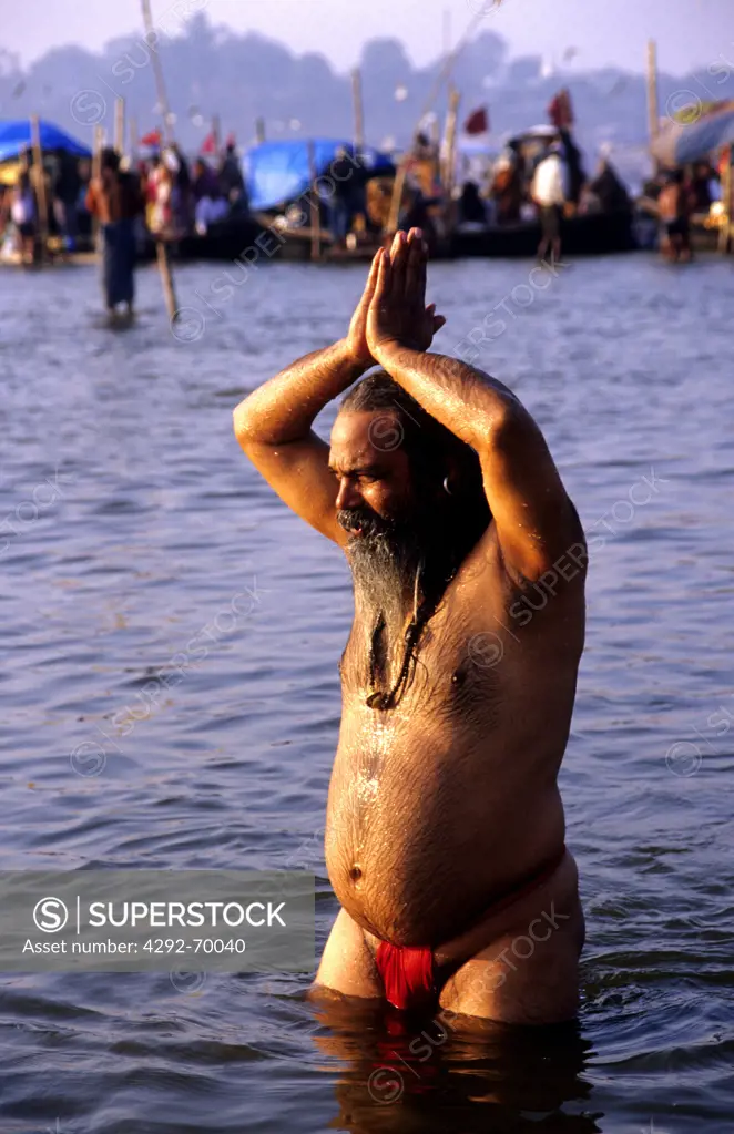 India,Uttar Pradesh, Allahabad (Prayag).Man at Kumbh Mela holy Festival bathing in Sangam river