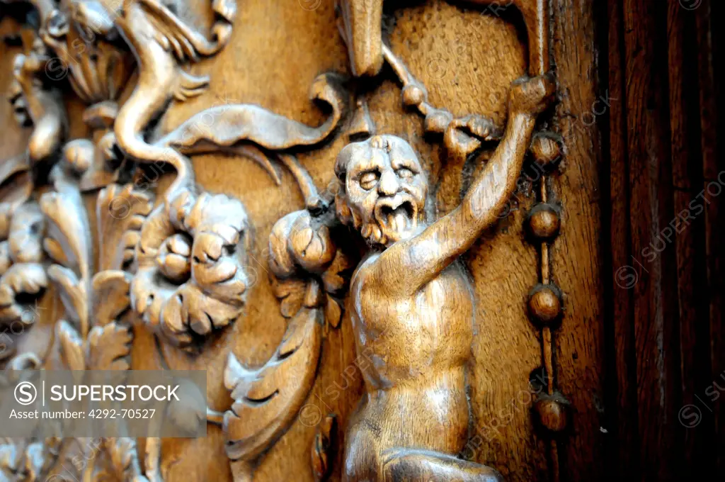 Italy, Umbria, Assisi, The San Francesco d'Assisi basilica. Detail of the wooden portal