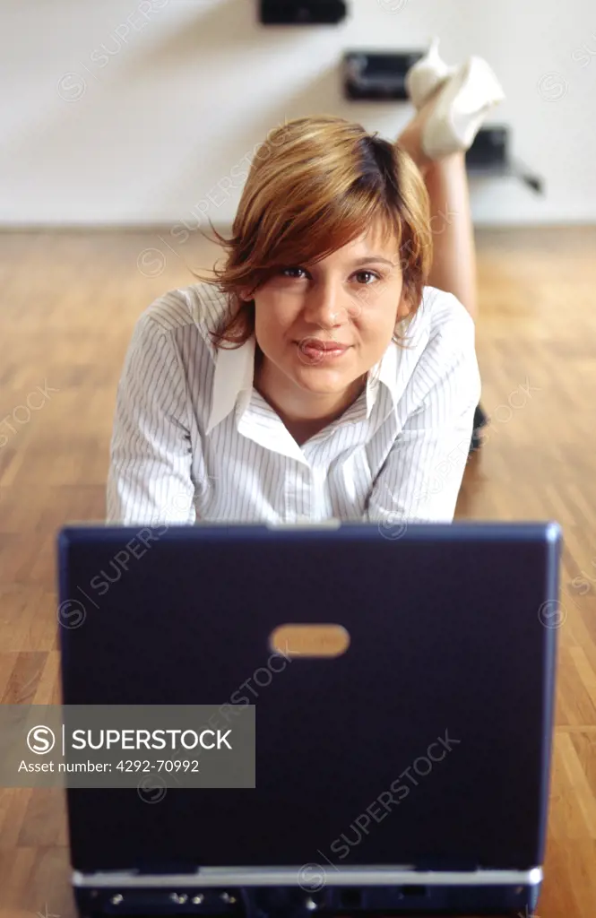Businesswoman working on laptop.