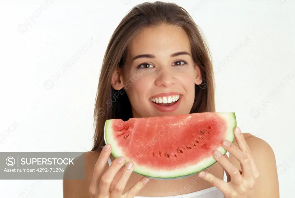 Portrait of a young woman with watermelon
