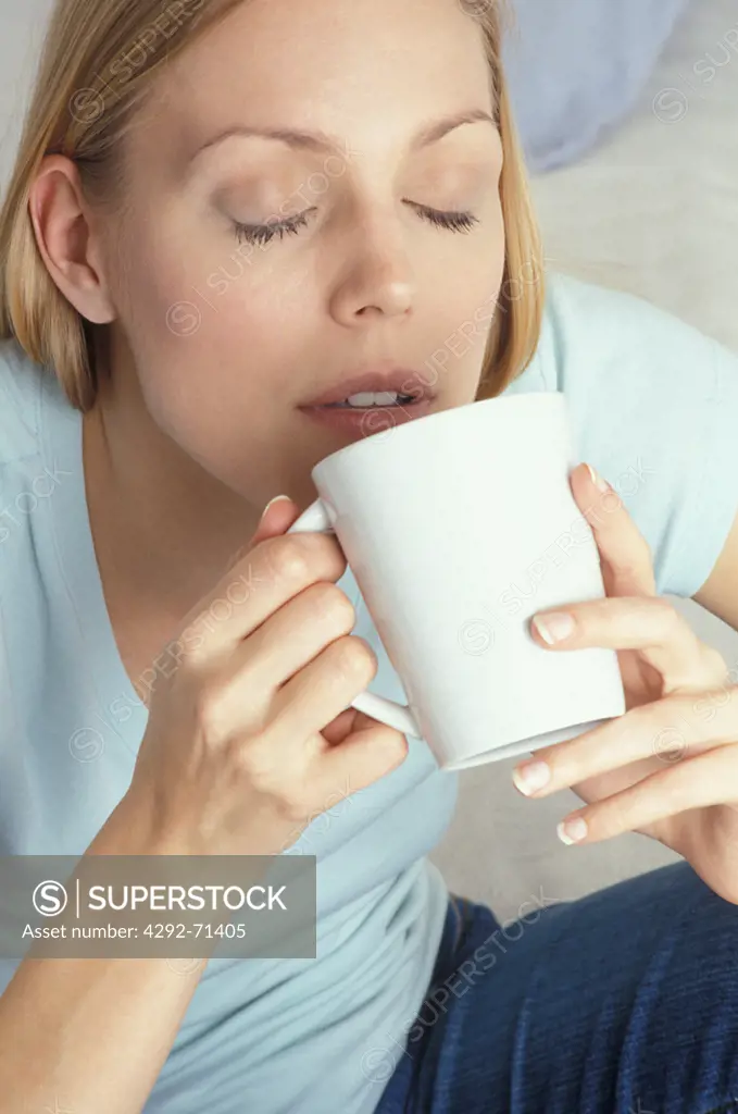 Woman drinking from a cup