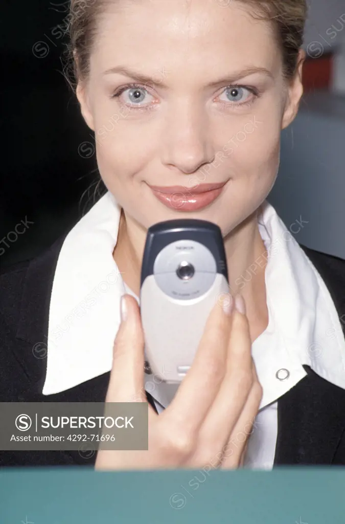 Woman with camera phone