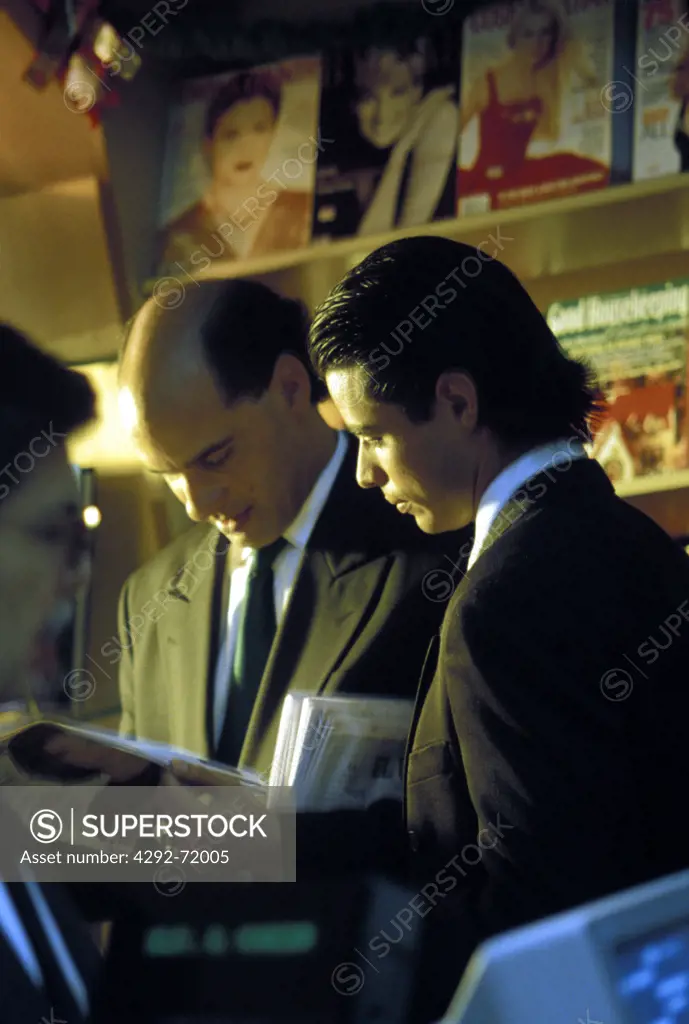 Men reading magazines