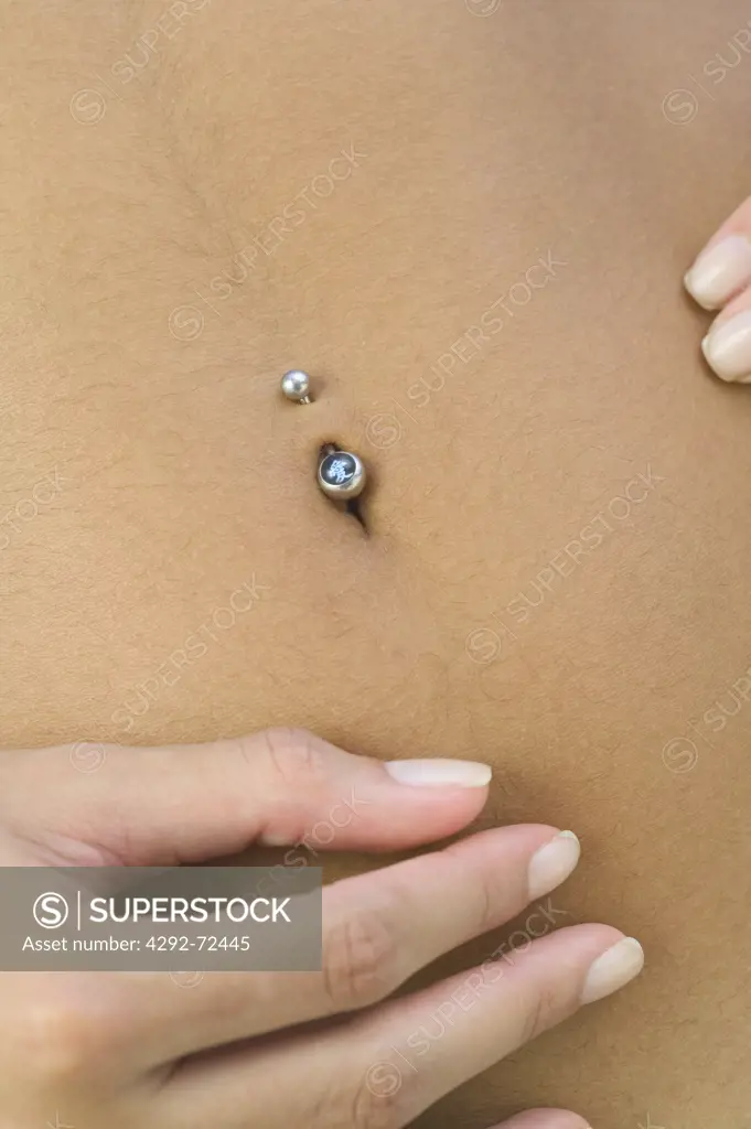 Woman pierced navel