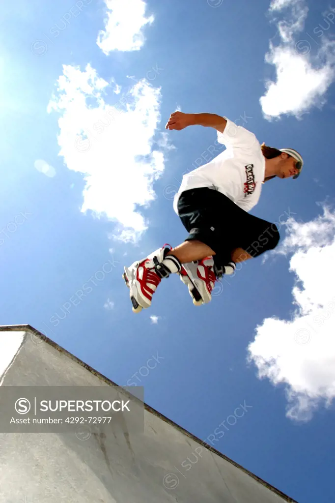 Teen on rollerblades in Skate Park,Park City, Utah, USA