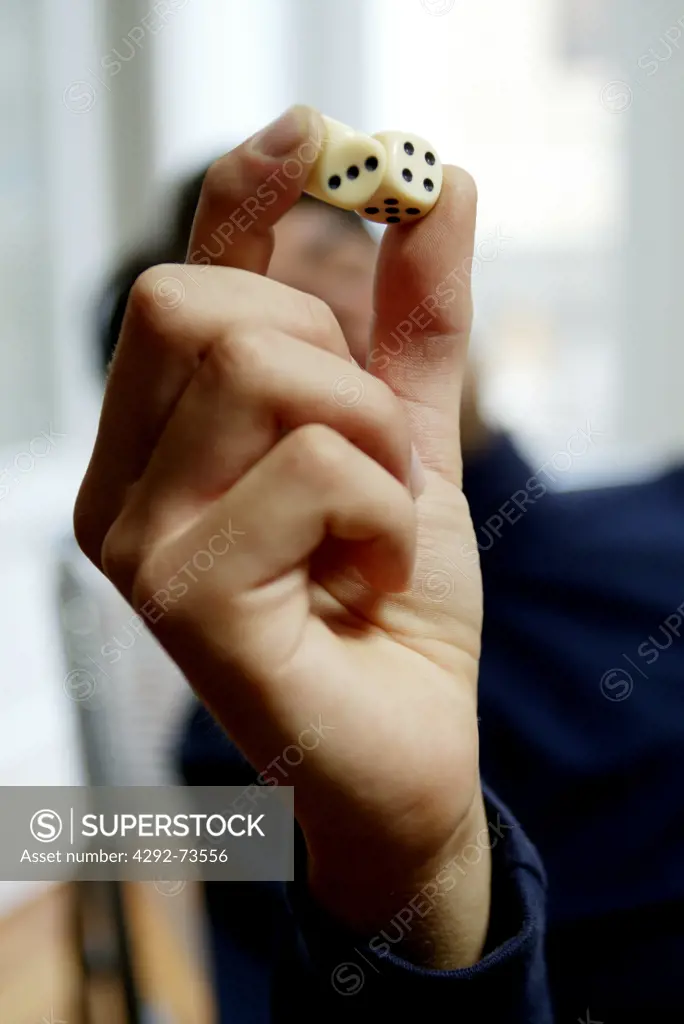 Hand holding dice