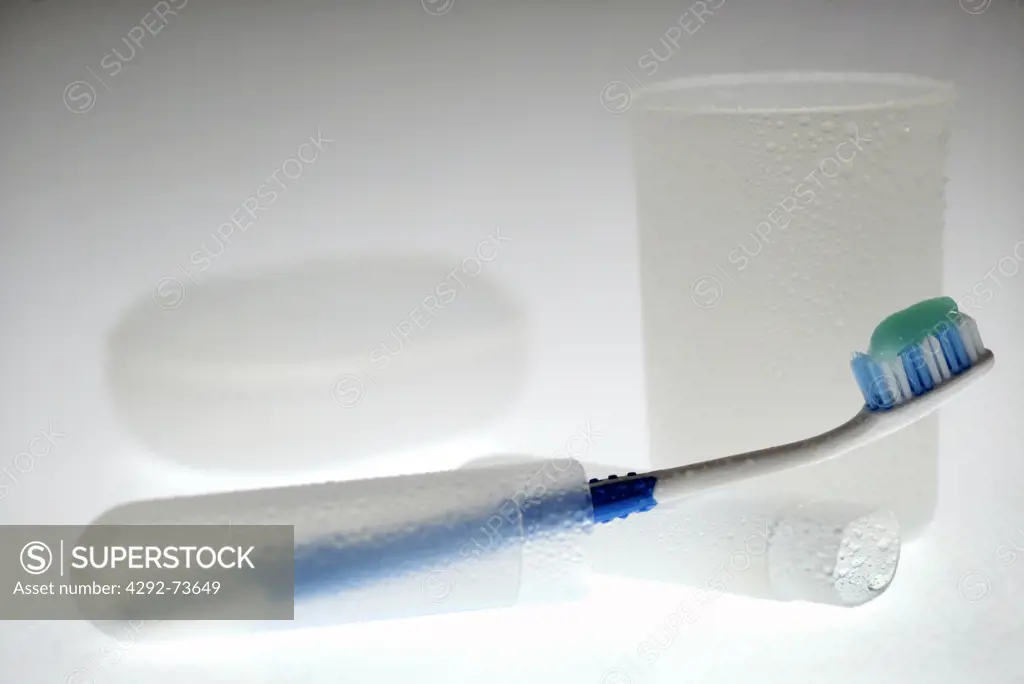 Toothbrush with a plastic cup