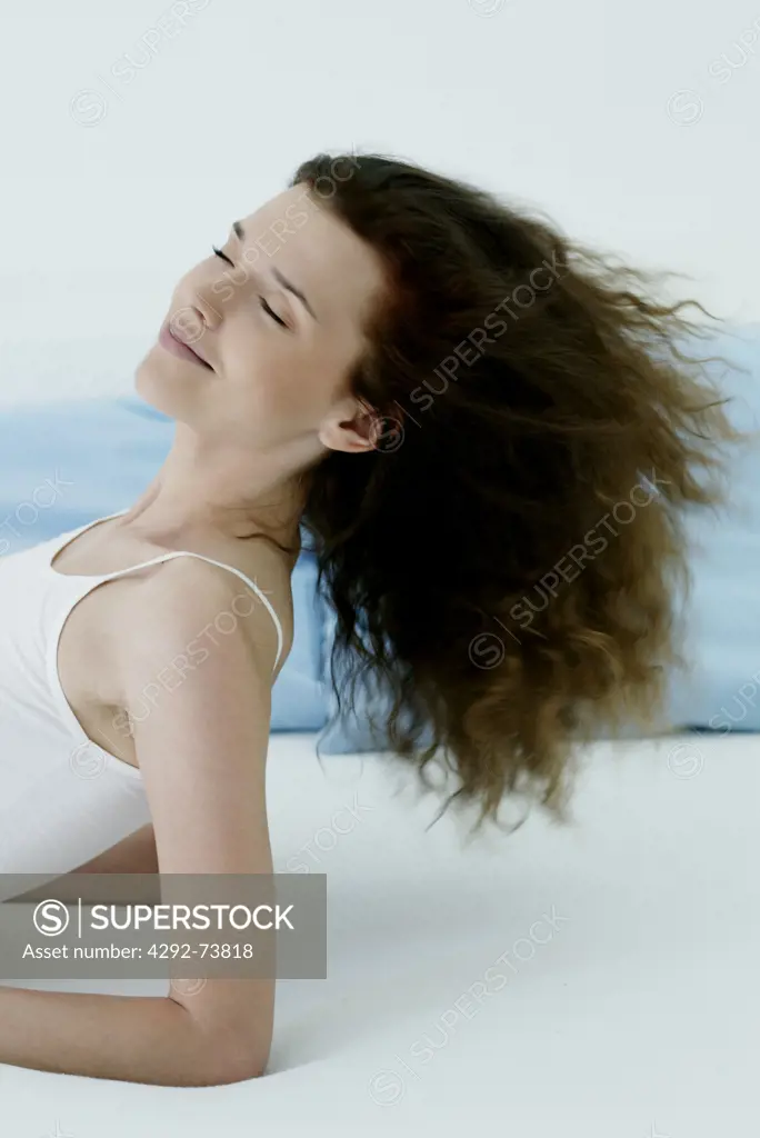 Woman throwing her head back