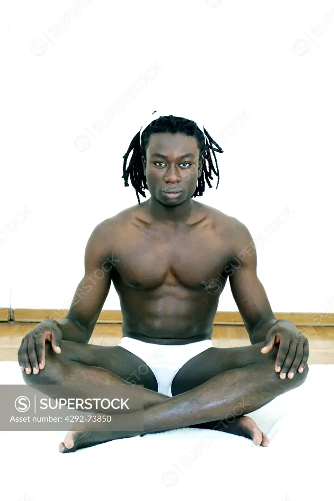 Afro-american man doing yoga