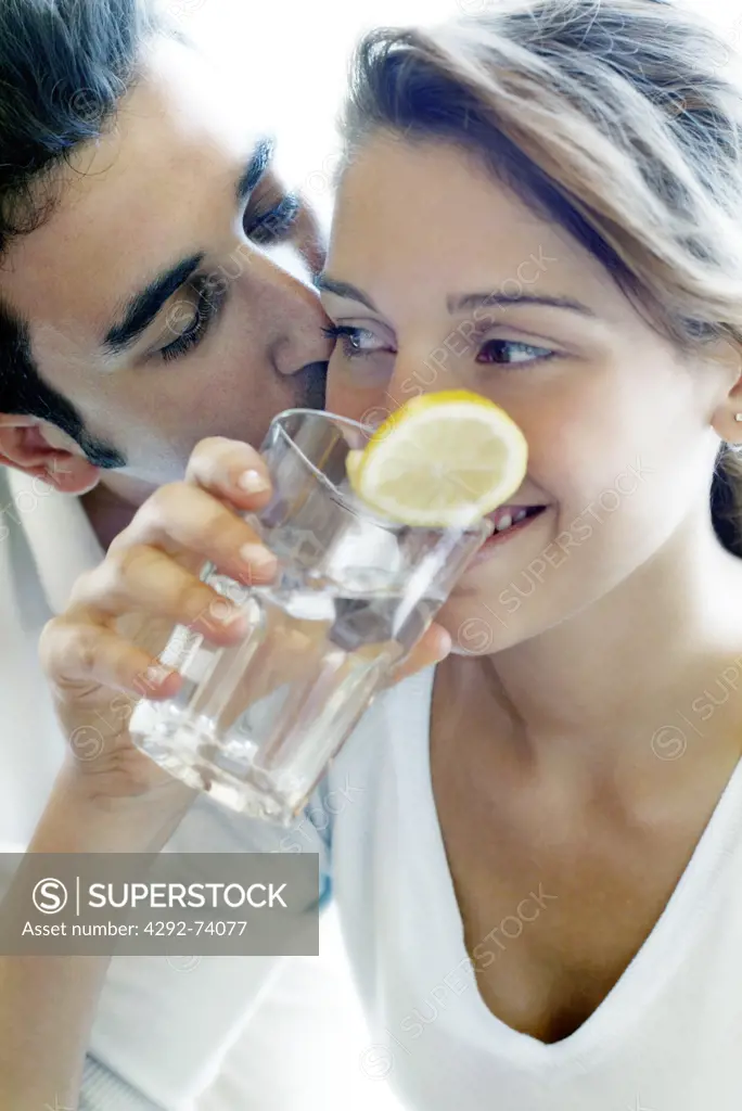 Couple drinking a glass of water