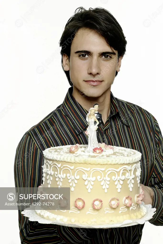 Man holding wedding cake