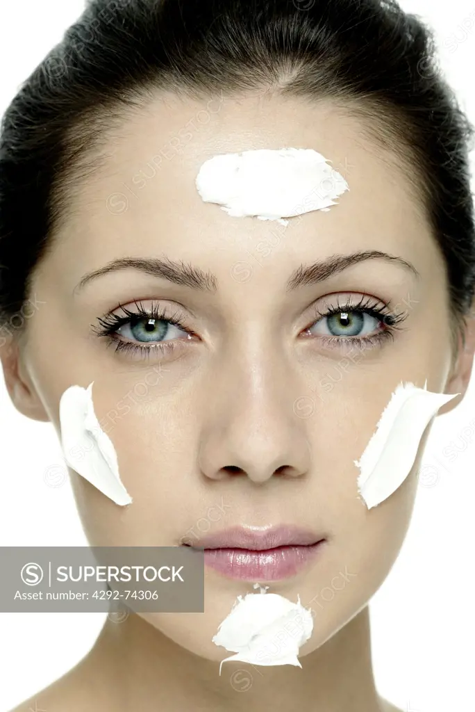 Woman with cream in her face