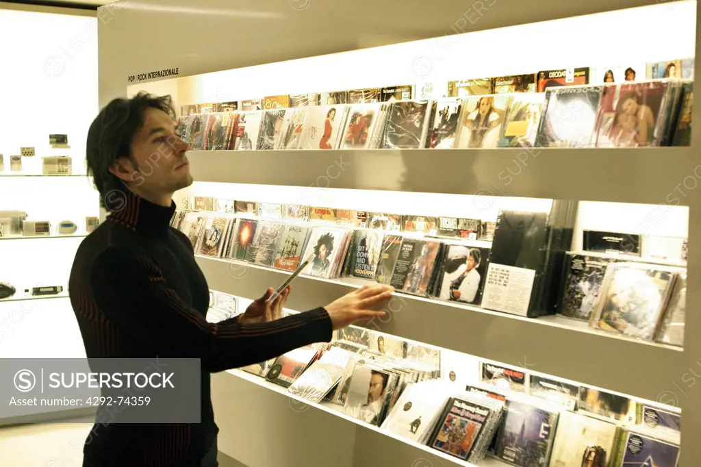 Man choosing a compact disc