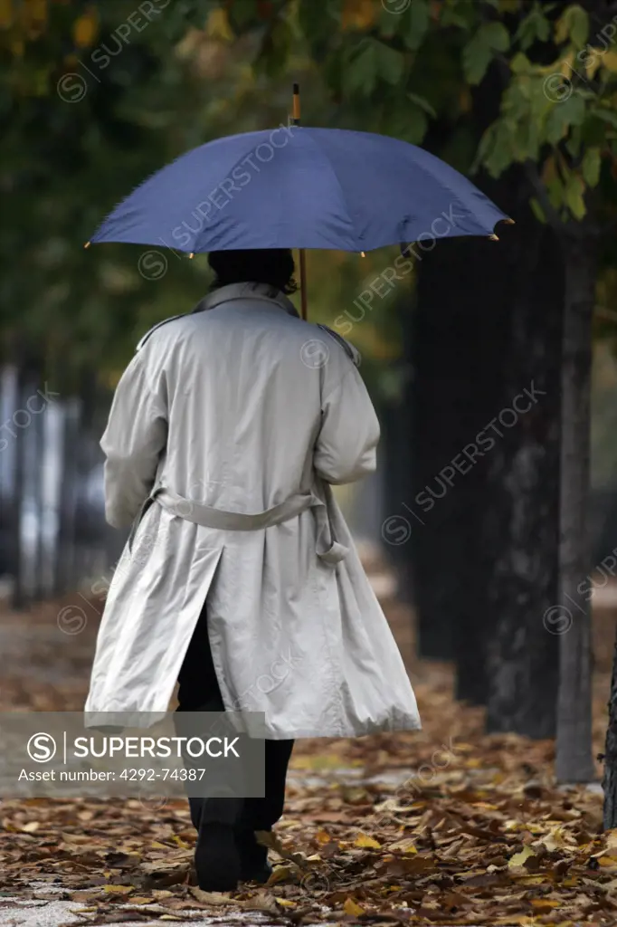 Man with umbrella from behind