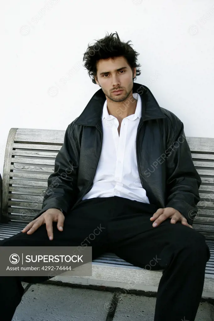 Man's portrait sitting on bench