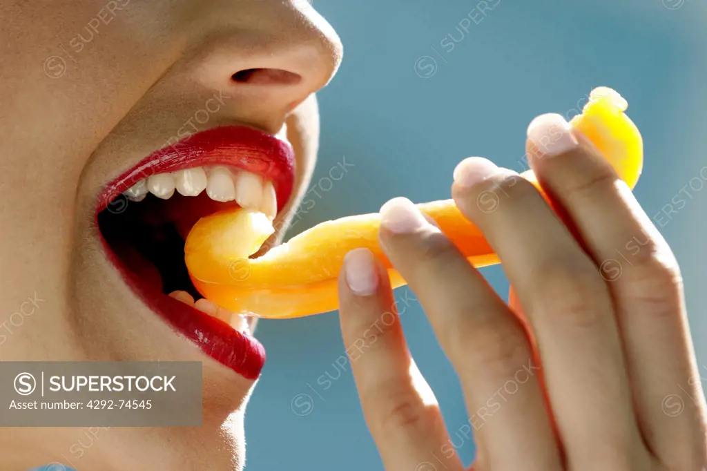 Woman eating melon, detail