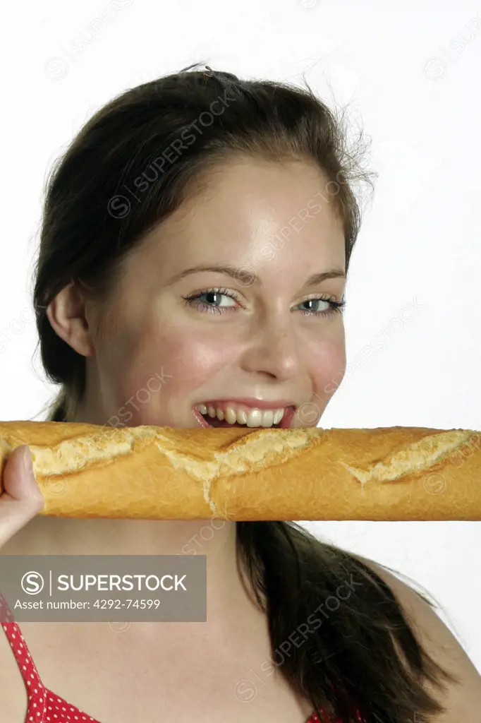 Younf woman biting a baguette