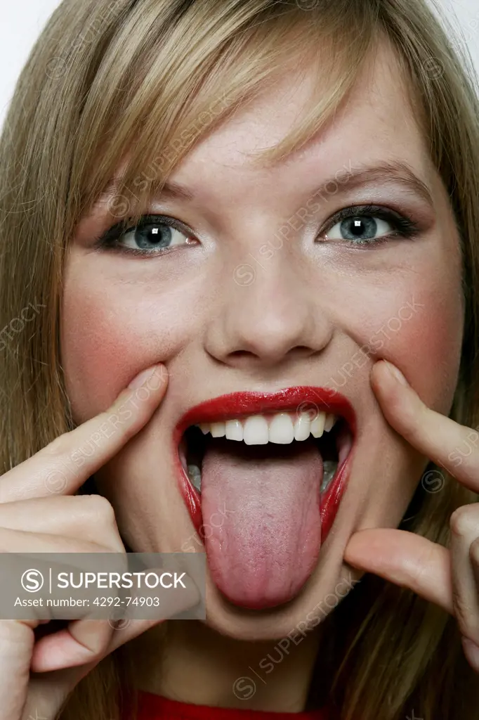 Young woman making faces