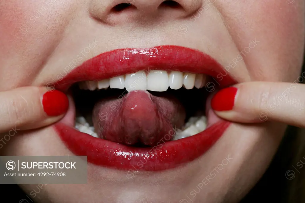 Woman's mouth sticking out her tongue