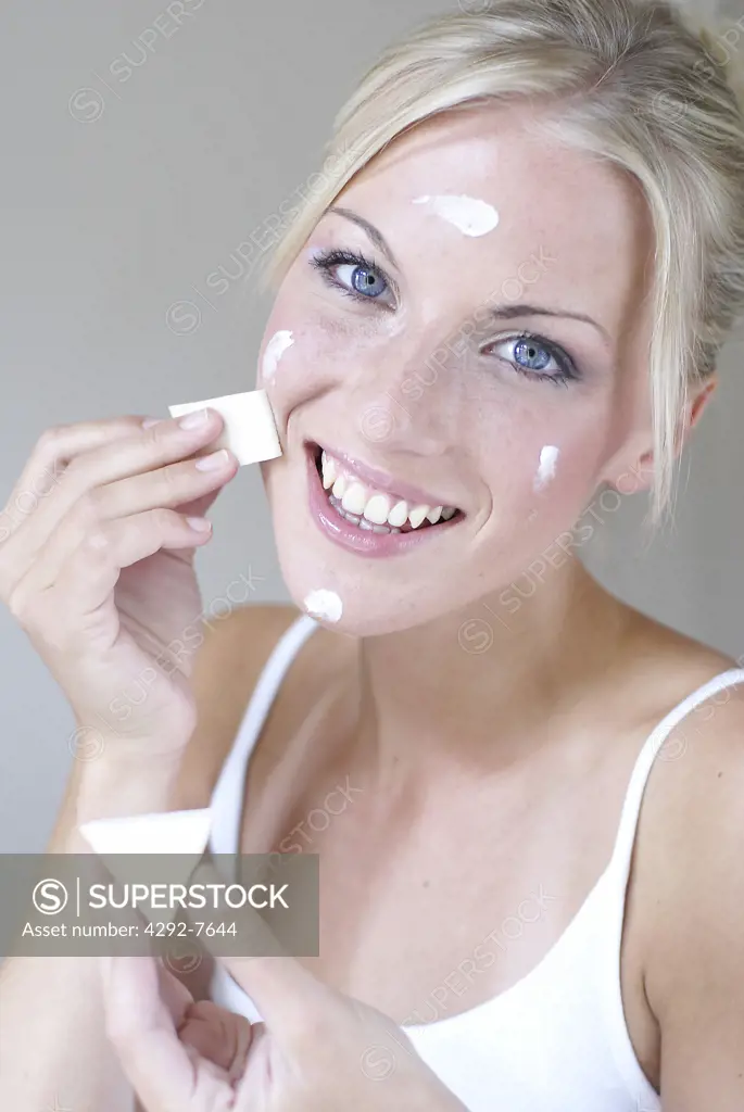 Close up of woman removing make up