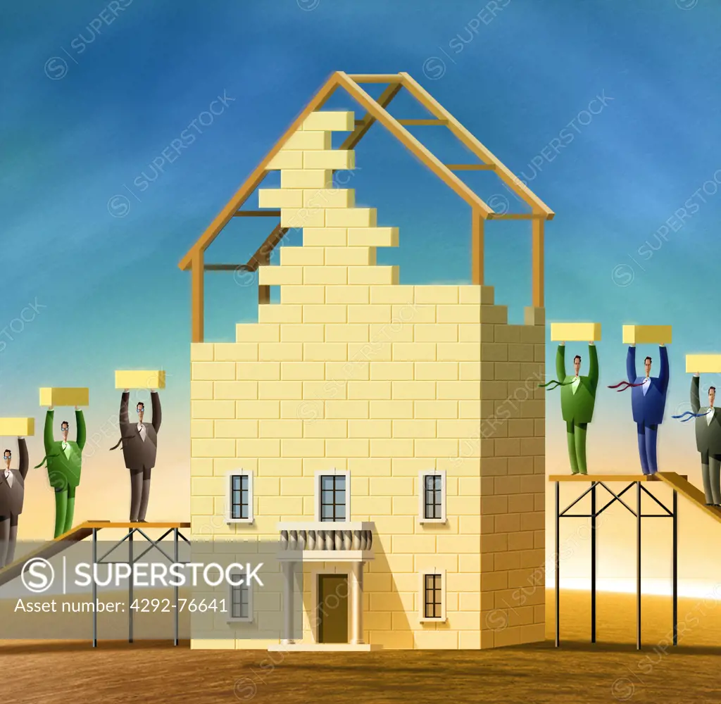 Businessman building a house