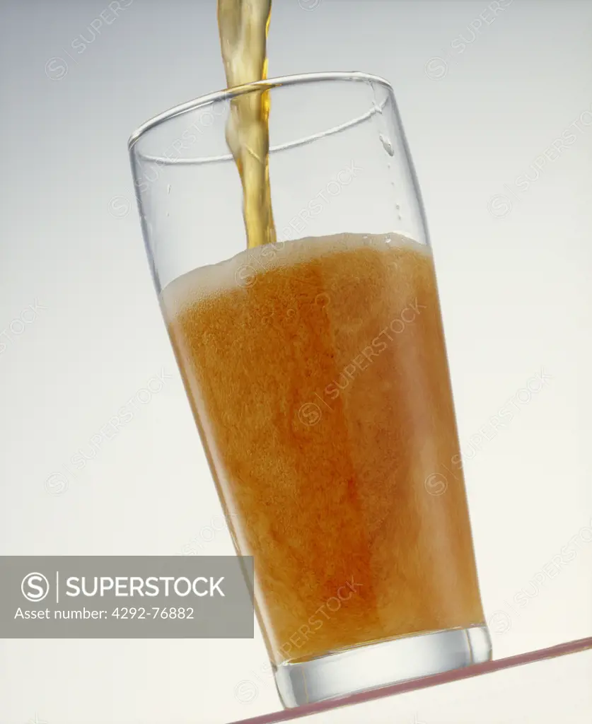 Pouring beer in a glass