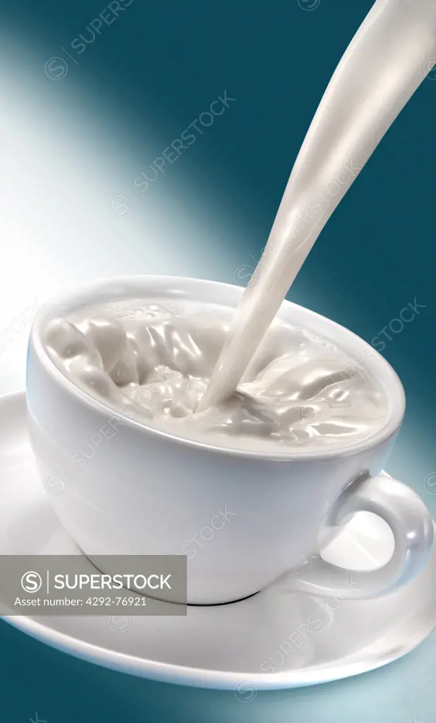 Pouring milk into cup
