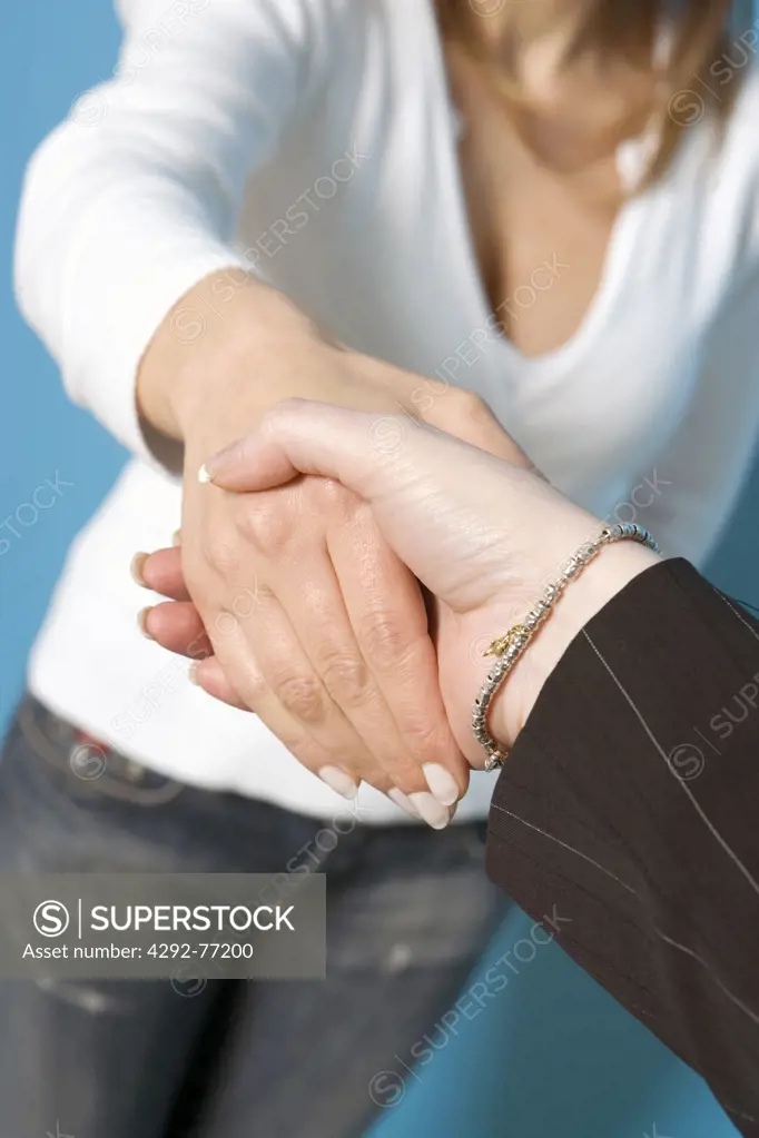 Closeup  of two women shaking hands