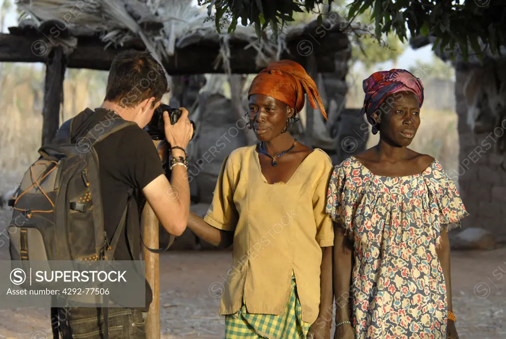 Africa, Burkina Faso, photographer taking women picture