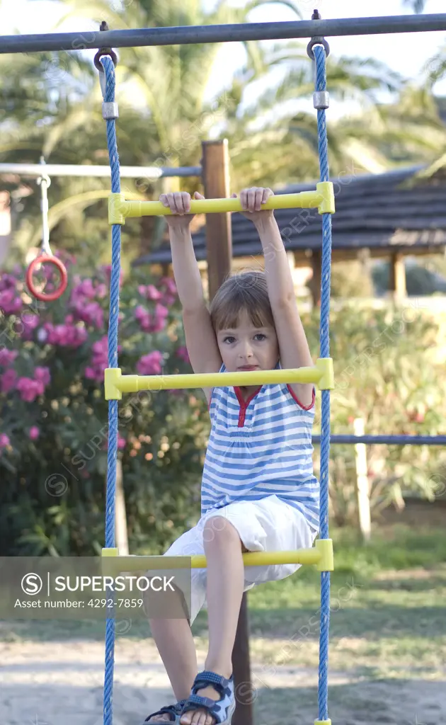 Young girl swinging