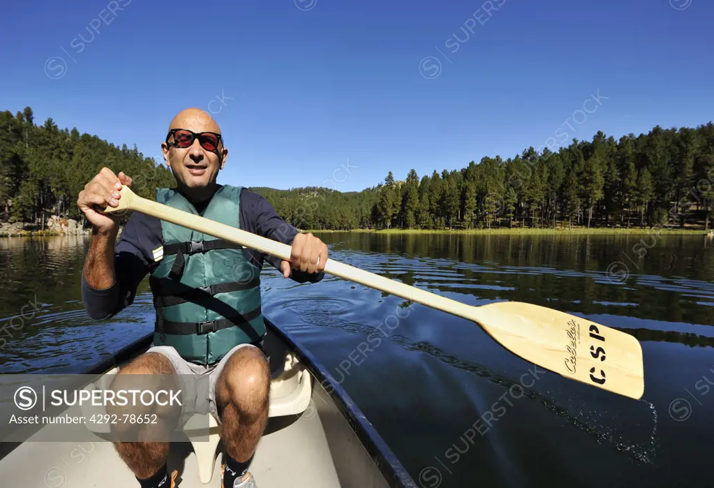 USA, South Dakota, Black Hills National Forest, Custer State Park, a Man Sea Kayaking on Lake