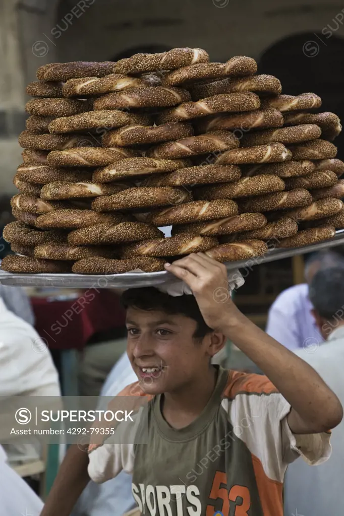 Turkey, Urfa, Bazaar, Young Bread Seller